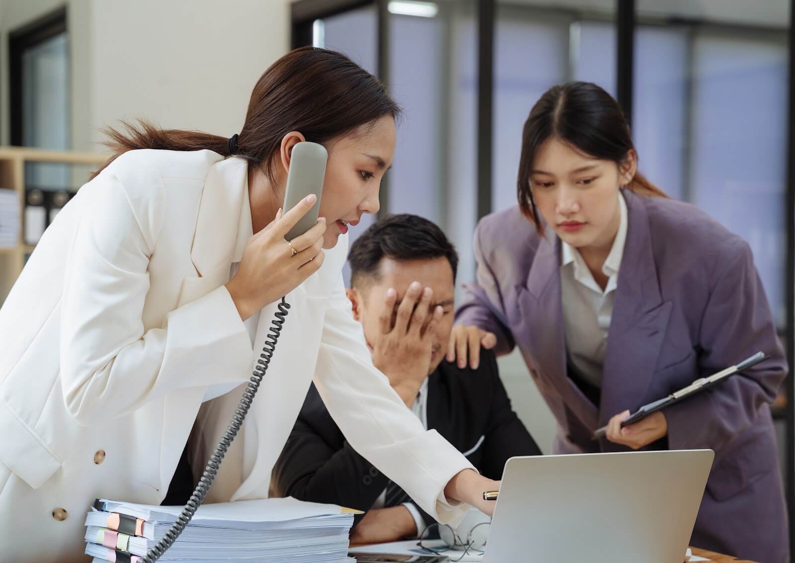Frustrated business team struggling with disconnected communication systems before unified customer engagement.